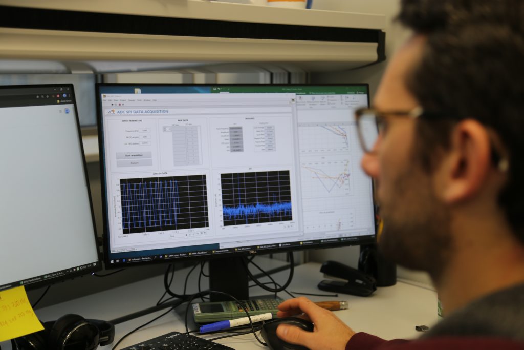 Characterization Engineer and Lab Manager conducts test on an ASIC